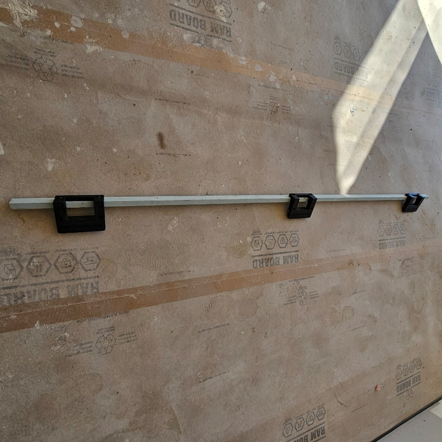 Adjustable door hinge jig system attached to an 18mm timber story rod for accurate door and jamb routing.